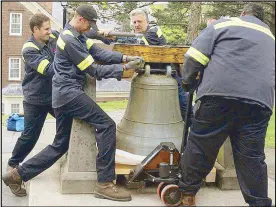  ??  ?? Photo taken from asianjourn­al.com shows workers removing the San Pedro bell from its base in West Point, New York.
