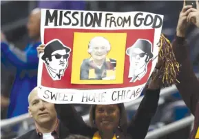  ?? RONALD MARTINEZ/ GETTY IMAGES ?? Excited Ramblers fans had Sister Jean joining the Blues Brothers as Chicago icons during March Madness.