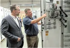  ?? Picture: FREDLIN ADRIAAN ?? EXCITING VENTURE: senior vicepresid­ent ABB
Graham
Abrahams, left, on a tour at Eya Bantu's
Gqberha facility with the company's director, Jadri Hurter, during the launch of the new ZX series gas insulated switchgear