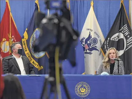  ?? Will Waldron / Times Union ?? Albany County Executive Dan Mccoy, left, and Albany County Health Commission­er Dr. Elizabeth Whalen urge residents Thursday to avoid traveling for the holidays.