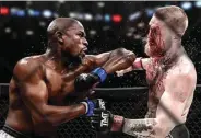  ?? TWITTER ?? PROVOKASI: Floyd Mayweather Jr (kiri) mengunggah foto editan yang memperliha­tkan dirinya menghajar Conor McGregor.