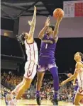  ?? MARCIO JOSE SANCHEZ AP ?? Washington forward Keion Brooks (1) shoots over USC’S Tre White (left) during the first half Saturday.