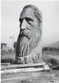  ?? BRIAN MELLEY/AP 2015 ?? A wood-carved statue of John Muir by R.L. Blair is seen on the road leading to Sequoia National Park.