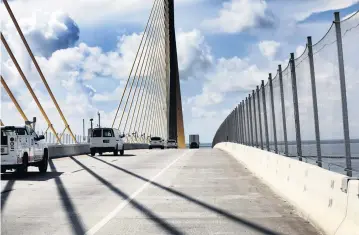  ?? DOUGLAS R. CLIFFORD Tampa Bay Times | July 21, 2021 ?? Nearly a year since fences along the top of the Sunshine Skyway Bridge were completed, suicides there have decreased.