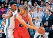  ?? [PHOTO BY BRYAN TERRY, THE OKLAHOMAN] ?? Dakari Johnson, left, has played limited minutes for the Thunder in the past month. He’s staying fresh by logging some minutes for the Oklahoma City Blue, the team’s G League affiliate.