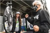  ?? ?? Robert Provenzano spins a prize wheel during the Change the Game Rally in the parking lot near Gate 5 of Guaranteed Rate Field on Monday.