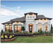  ??  ?? Shown is the Juniper model home in Cinco Ranch at The Enclave at Ridgefield Heights.