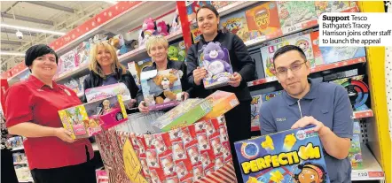  ??  ?? Support Tesco Bathgate’s Tracey Harrison joins other staff to launch the appeal