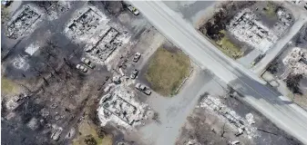  ?? THE CANADIAN PRESS ?? Damaged structures are seen in Lytton after a wildfire destroyed most of the village on June 30. About 300 wildfires are currently burning across B.C.