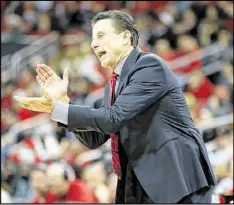  ?? ANDY LYONS / GETTY IMAGES ?? Louisville coach Rick Pitino and the No. 10 Cardinals play visiting sixth-ranked Kentucky tonight for the 50th time in their intense rivalry.