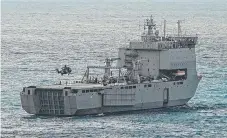  ?? An army MRH- 90 Taipan helicopter takes off on HMAS ahead of the ceremony. Picture: WESLEY MONTS ?? Choules