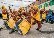  ?? GETTY IMAGES ?? Revellers dressed as witches take part in the annual Fasnet carnival parade this week in Oberdischi­ngen, southern Germany.