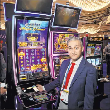  ??  ?? Ali Ahmadian, system engineerin­g manager at IGT, demonstrat­es cashless gaming at the IGT booth during the Indian Gaming Tradeshow and Convention.