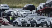 ?? BEN MARGOT — THE ASSOCIATED PRESS FILE ?? Tesla cars are loaded onto carriers at the Tesla electric car plant in Fremont on May 13, 2020.