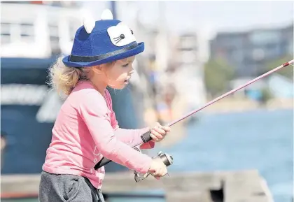  ?? Photo / Duncan Brown ?? Ivy Rochester, 4, from Napier, enjoys a sunny spring day fishing on Napier’s West Quay.