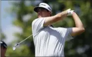  ?? NICK WASS — THE ASSOCIATED PRESS ?? Beau Hossler watches his tee shot on the 17th tee during the second round of the Quicken Loans National golf tournament, Friday in Potomac, Md.