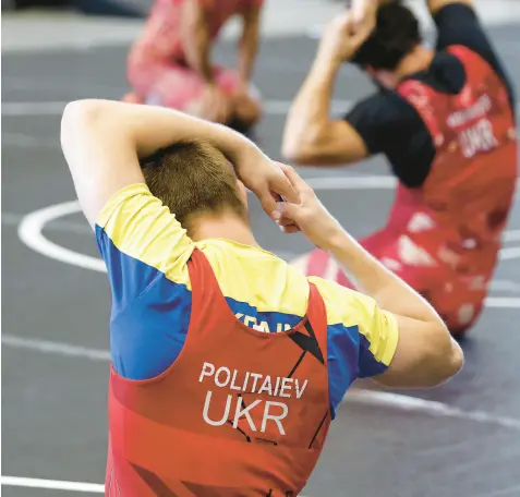  ?? JOHN SMIERCIAK/POST-TRIBUNE PHOTOS ?? Members of the men’s Ukrainian Olympic Greco-Roman Wrestling Team have been training at Hammond Central High School for most of July, and will finish on Aug.3.