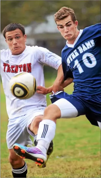  ?? Trentonian PHOTO/GREGG SLABODA ?? Notre Dame’s Brian Hawkins, right, and Trenton’s Heiler Montero battle for the ball. Hawkins scored one goal and added two assists in the 3-1 victory.