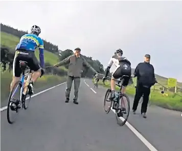  ??  ?? One competitor in the Tour O The Borders race posted footage of the moment the men halted riders, holding sticks across the road