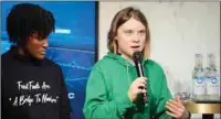  ?? (AFP) ?? Sweden’s activist Greta Thunberg (right) speaks next to Ugandan climate justice activist Vanessa Nakate in Davos, on Thursday.