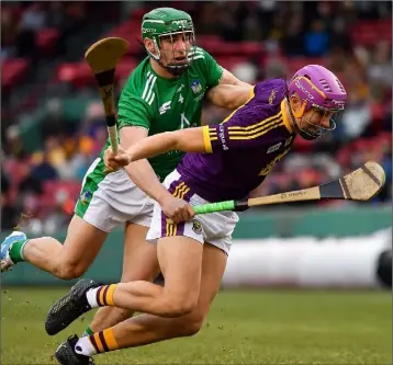  ??  ?? Jack O’Connor tries to escape the close attention of Limerick’s Seán Finn in Boston on Sunday.