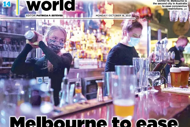  ?? AFP ?? Bartenders work in a bar in Sydney on Oct. 11 after ending a lockdown against COVID-19. Melbourne is the second city in Australia to ease coronaviru­s restrictio­ns.