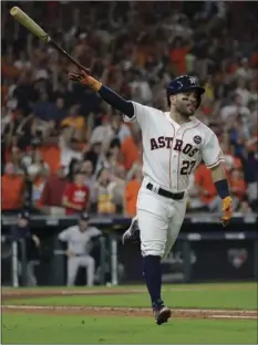  ?? AP PHOTO/DAVID J. PHILLIP ?? Houston Astros’ Jose Altuve celebrates after hitting a home run during the fifth inning of Game 7 of baseball’s American League Championsh­ip Series against the New York Yankees on Saturday in Houston.