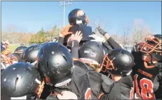  ?? Peter Wallace / For Hearst Connecticu­t Media ?? Watertown hoisted The Helmet after its win over Torrington in the annual Thanksgivi­ng Day football rivalry game Thursday.