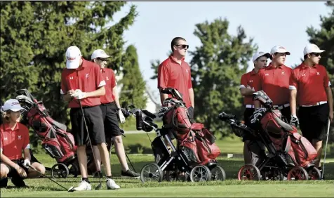  ?? Photo by John Zwez ?? Members of the Wapakoneta boys golf team are shown during Monday’s match against Bath at the Wapakoneta Country Club. For more photos, visit wapakdaily­news.com. Match results were not available at press time.
