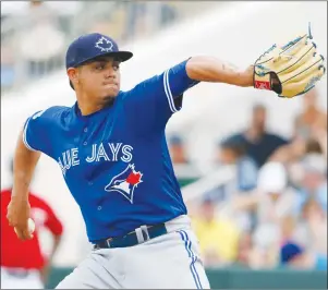  ?? CP PHOTO ?? Toronto Blue Jays relief pitcher Roberto Osuna works against the Minnesota Twins in the fifth inning of a spring training baseball game, Wednesday.