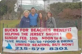  ??  ?? From left, Bucks for Beaches volunteer, Sharon Joyce, La Stalla owner Marc Masso and Bucks for Beaches volunteers Christine Nelson and Julie Lambert show off the banner touting the benefit for victims of Hurricane Sandy.