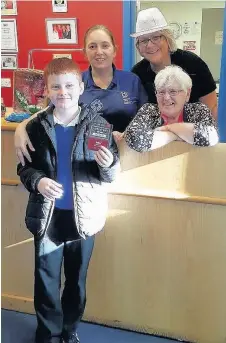  ??  ?? Winner Darren Williams with volunteers at the newly named ‘Hillstop Cafe’