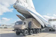  ??  ?? A military truck loads medical supplies bound for Italy last month on a cargo plane at the Chkalovsky military airport near Moscow.