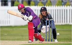  ?? GETTY IMAGES ?? STORMY CLASH: Tammy Beaumont, of Lightning, batting against Thunder in a Rachel Heyhoe-Flint trophy match. Right, playing for London Spirit in The Thunder competitio­n last year and in England colours
