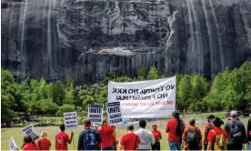  ?? Photograph: Erik S Lesser/EPA ?? Protesters gather against a group celebratin­g Confederat­e Memorial Day beneath the carving of Jefferson Davis, Robert E Lee and Thomas 'Stonewall' Jackson in Stone Mountain, Georgia.