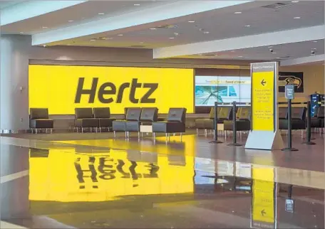  ?? George Rose Getty Images ?? HERTZ and Thrifty car rental workers prevailed in a four-year fight to force employers to abide by a minimum wage law in Seatac, Wash.