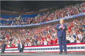  ?? (Leah Millis/Reuters) ?? US PRESIDENT Donald Trump arrives onstage at his first reelection campaign rally in several months, in the midst of the coronaviru­s outbreak, at the BOK Center in Tulsa, Oklahoma, on Saturday.