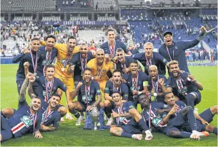  ??  ?? RAISING THE BAR: PSG players celebrate with the trophy after winning the French Cup final.