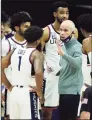  ?? David Butler II / Associated Press ?? UConn coach Dan Hurley talks to his team during a break in the action against Seton Hall in February at Gampel Pavilion.