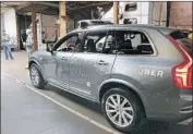  ?? Eric Risberg Associated Press ?? AN UBER self-driving car was involved in a crash Sunday that killed a pedestrian in Tempe, Ariz.