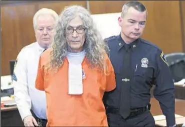  ?? AP ?? Rodney Alcala (center) died Saturday at a hospital in California, where he was on Death Row for strangling four women and a girl in the 1970s. He also pleaded guilty to killing two Manhattan women.