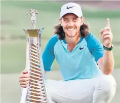  ?? — AFP photo ?? Tommy Fleetwood poses with the Race to Dubai trophy at the end of the final round of the DP World Tour Golf Championsh­ip at Jumeirah Golf Estates in Dubai.