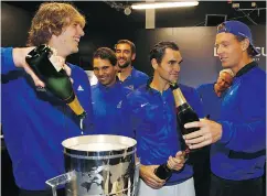  ?? CLIVE BRUNSKILL / GETTY IMAGES FOR LAVER CUP ?? Alexander Zverev, Rafael Nadal, Roger Federer and Tomas Berdych of Team Europe drink champagne after winning the Laver Cup on the final day on Sunday.