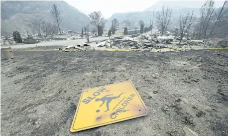  ?? JONATHAN HAYWARD/THE CANADIAN PRESS ?? The area of Boston Flats, B.C. is pictured Tuesday after a wildfire ripped through the area earlier in the week.