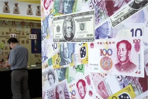  ??  ?? China has tightened rules on moving capital outside the country in recent months as it seeks to support the yuan currency and stem a slide in reserves. (Reuters)