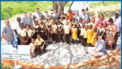  ??  ?? Noranda Bauxite’s education outreach is supported by Noranda Corporate as employees of overseas entities join their Jamaican counterpar­ts in constructi­ng a Reading Area for the nearby Waltham Abbey Primary