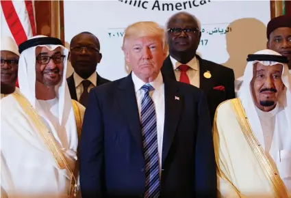  ?? (Photo by Evan Vucci, AP) ?? President Donald Trump poses for photos with King Salman and others at the Arab Islamic American Summit, at the King Abdulaziz Conference Center, Sunday in Riyadh, Saudi Arabia.