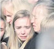  ??  ?? Above: Roberta Sloss comforts her daughter Rebekah at Alistair’s funeral, and (below) Alistair and Rebekah in happier times. Left: A treasured family photo of Roberta and Alistair with their children (from left) Sarah, David, Jonathan, Naomi and Rebekah