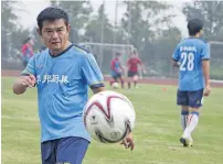  ?? AFP ?? Zhao Chongshan, 63, taking part in a training session. —