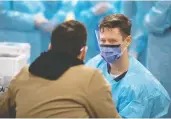  ?? JUSTIN TANG / THE CANADIAN PRESS ?? From masks to protective equipment, health care workers say they are receiving conflictin­g advice.